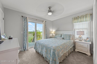 This meticulously maintained four-bedroom, three-bath waterfront