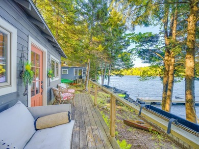 Set along approximately 150 feet of pristine shoreline on the - photo 2