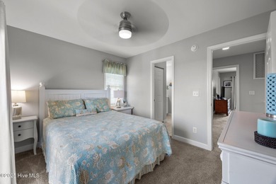 This meticulously maintained four-bedroom, three-bath waterfront