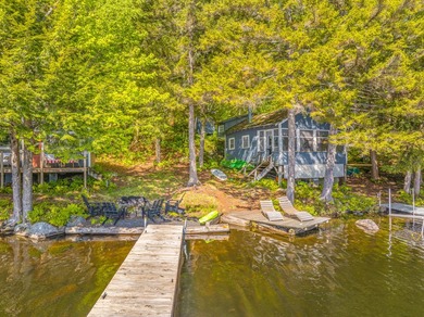 Set along approximately 150 feet of pristine shoreline on the - photo 3