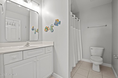 This meticulously maintained four-bedroom, three-bath waterfront