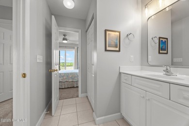 This meticulously maintained four-bedroom, three-bath waterfront