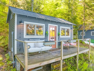Set along approximately 150 feet of pristine shoreline on the - photo 5
