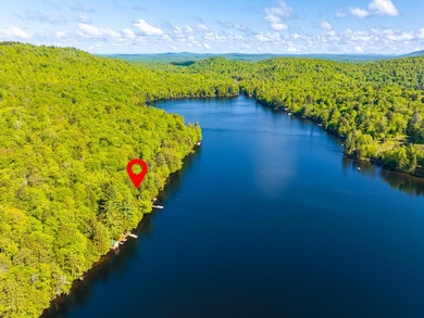 Set along approximately 150 feet of pristine shoreline on the - photo 7