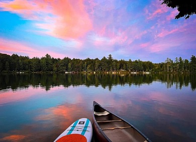 Set along approximately 150 feet of pristine shoreline on the - photo 9