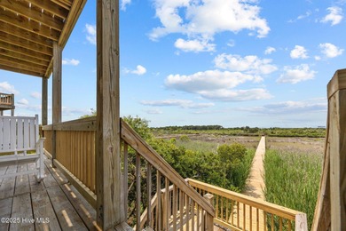 This meticulously maintained four-bedroom, three-bath waterfront