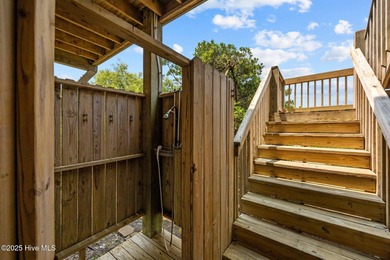 This meticulously maintained four-bedroom, three-bath waterfront