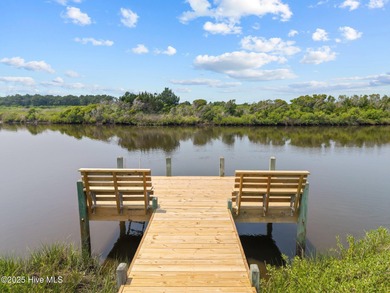 This meticulously maintained four-bedroom, three-bath waterfront