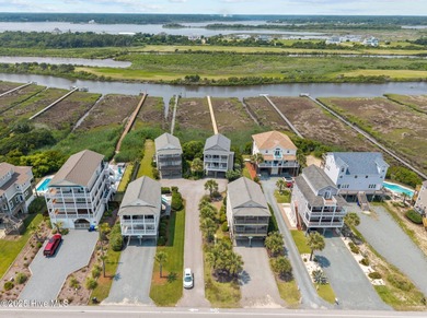 This meticulously maintained four-bedroom, three-bath waterfront