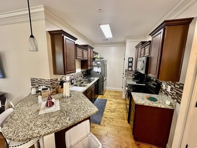 Welcome to this elegant three-bedroom, two-bathroom condominium - photo 5