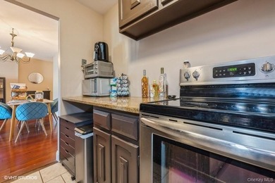 WELCOME HOME TO THIS BEAUTIFUL LIGHT AND BRIGHT RENOVATED CO-OP