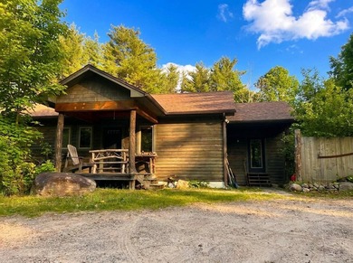 This 3-bedroom, 2-full-bath home in Wilmington, NY sits on a - photo 3