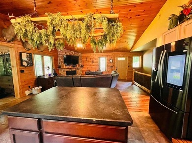 This 3-bedroom, 2-full-bath home in Wilmington, NY sits on a - photo 8