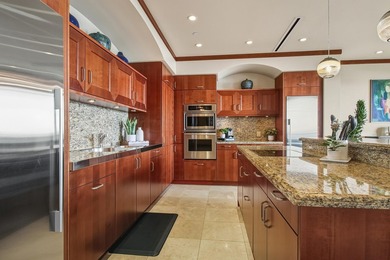 Welcome to this stunning top-floor oceanfront residence in the - photo 6