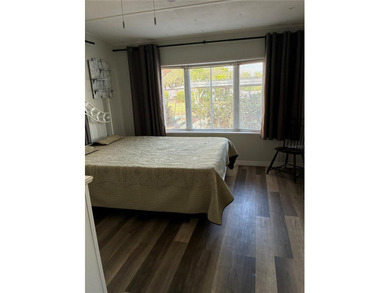 This home is located in a 55+ Community.   Situated on the Chain - photo 7