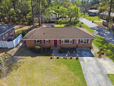 Charming 4-bedroom home situated on a spacious corner lot shaded - photo 2