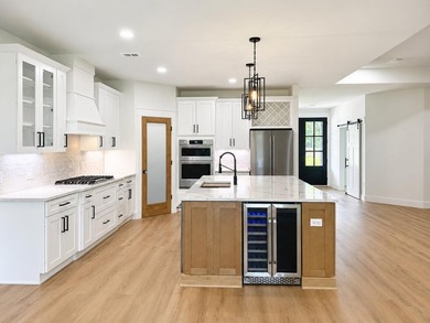 Welcome to 8756 Sand Pine Drive--a truly rare new-construction - photo 1