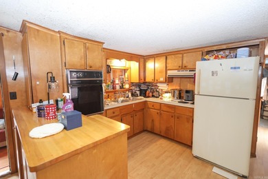 Conveniently located near Lake Greeson and area ATV trails, this - photo 4