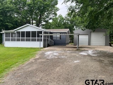 Step into comfort and style with this beautifully updated 2009 - Lake Home For Sale in Pittsburg, Texas