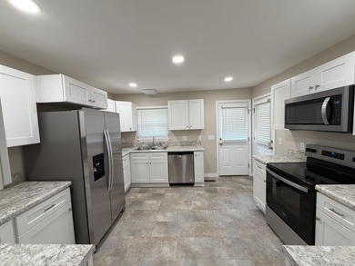 Step into this beautifully remodeled home, upgraded from the - photo 5