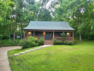 Cabin vibes, wooded views, extra lot, under $300,000.00. Located - photo 1