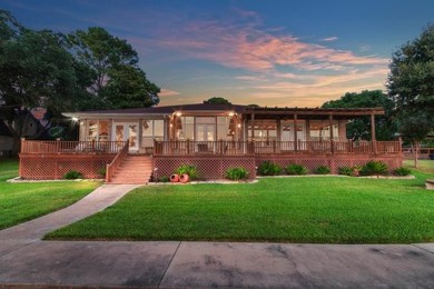 Experience stunning Caribbean sunsets at Cedar Creek Lake. This - Lake Home For Sale in Gun Barrel City, Texas