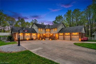 Nestled on a breathtaking wooded lot on the - photo 1