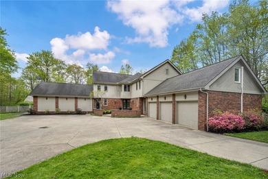 Nestled on a breathtaking wooded lot on the - photo 3