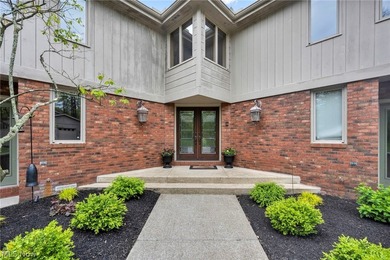 Nestled on a breathtaking wooded lot on the - photo 4