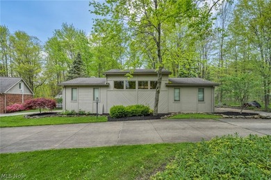 Nestled on a breathtaking wooded lot on the - photo 5