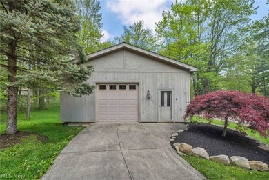 Nestled on a breathtaking wooded lot on the - photo 6