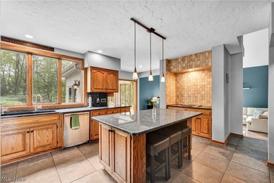 Nestled on a breathtaking wooded lot on the - photo 10