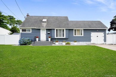 Welcome to this well-maintained oversized Cape located in the - photo 1