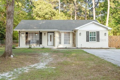 NO HOA! Spacious and inviting 4-bedroom, 2-bath brick home - photo 1