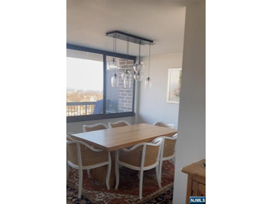 Welcome to this spacious two-bedroom residence at The Greenhouse