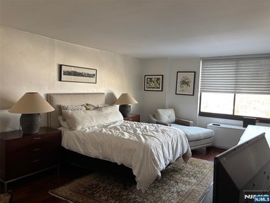 Welcome to this spacious two-bedroom residence at The Greenhouse