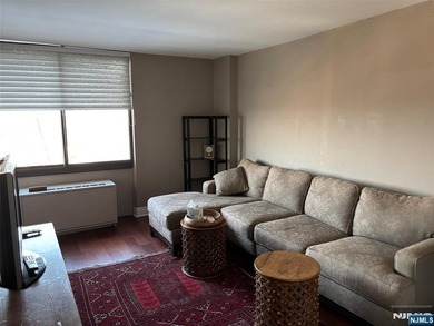 Welcome to this spacious two-bedroom residence at The Greenhouse