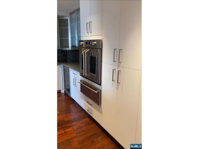 Welcome to this spacious two-bedroom residence at The Greenhouse