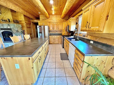 Authentic log cabin retreat on 80 picturesque acres featuring a - photo 13