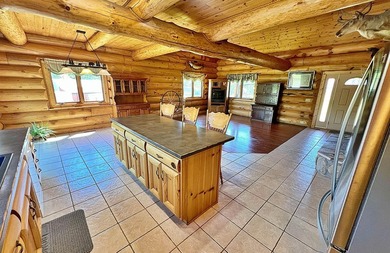 Authentic log cabin retreat on 80 picturesque acres featuring a - photo 14