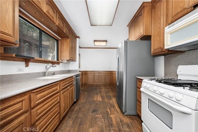 This 1924 low profile Spanish bungalow is located in one of the - photo 16