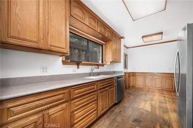 This 1924 low profile Spanish bungalow is located in one of the - photo 17