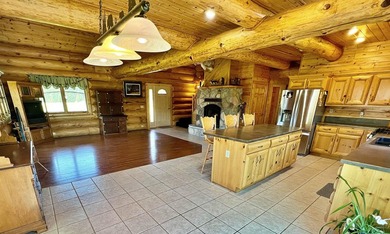 Authentic log cabin retreat on 80 picturesque acres featuring a - photo 17
