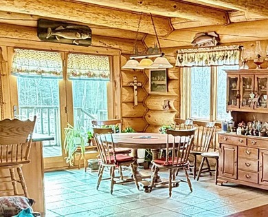 Authentic log cabin retreat on 80 picturesque acres featuring a - photo 18