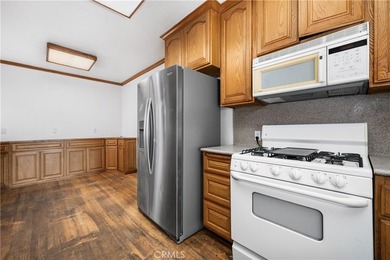 This 1924 low profile Spanish bungalow is located in one of the - photo 19