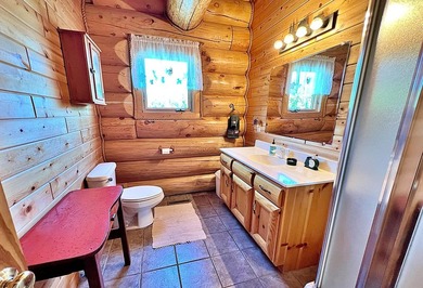 Authentic log cabin retreat on 80 picturesque acres featuring a - photo 21