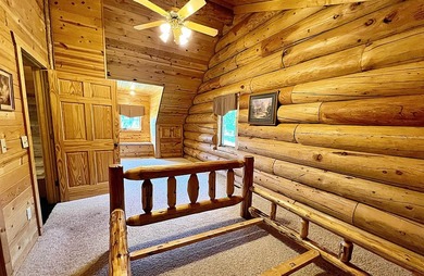 Authentic log cabin retreat on 80 picturesque acres featuring a - photo 26