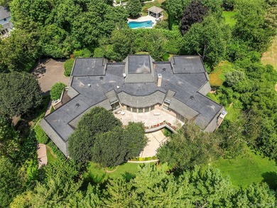 Situated on a sprawling 1.28-acre property, this 7,200+ - photo 2