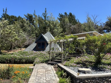 Perched atop a private hilltop with Pacific Ocean views, this - photo 25