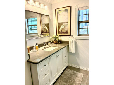 A refined waterfront retreat showcasing custom materials - photo 10
